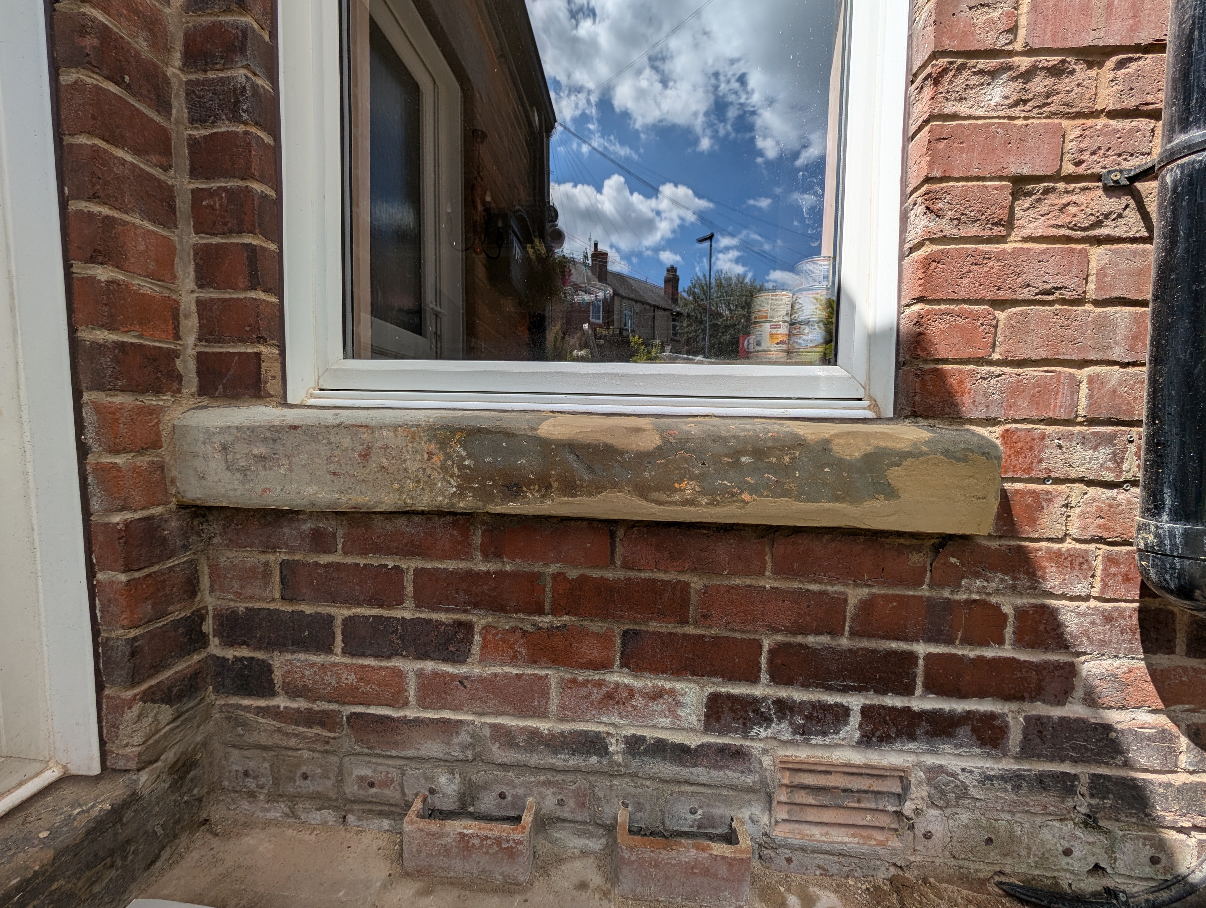 Plastic stone repair on damaged masonry
